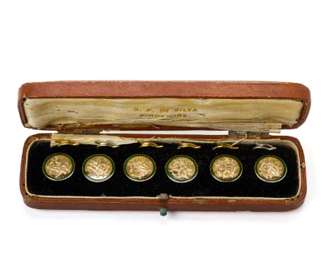 A SET OF SIX 9K GOLD AND ENAMEL BUTTONS
Circa 1900
Engraved with a monogram within a green enamelled border, marked '9ct' to 