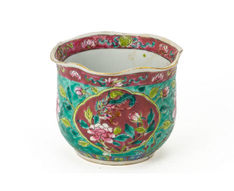 A TURQUOISE GROUND FAMILLE ROSE FINGER BOWL
With undulating scalloped rim, decorated with a pink ground reserve of a phoenix 