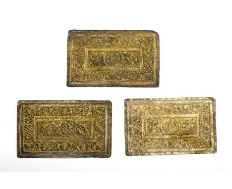 A SET OF THREE REPOUSSE SILVER GILT PILLOW ENDS
Each decorated in relief with a central rectangular panel of foliage and frui