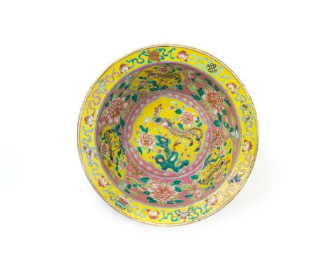 A PINK GROUND FAMILLE ROSE BASIN The interior decorated with yellow ground ogival shaped reserves of phoenixes with one foot 