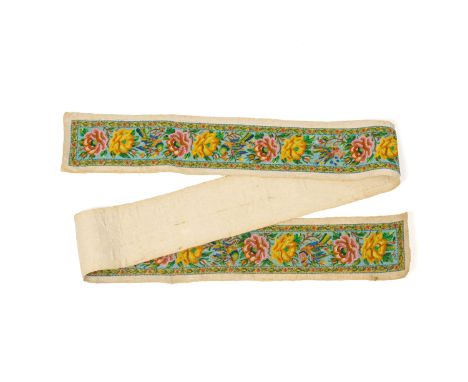 A BEADED TURQUOISE GROUND MATTRESS RUNNER
Decorated with peonies, flowering foliage and birds
194cm long x 12cm high (includi