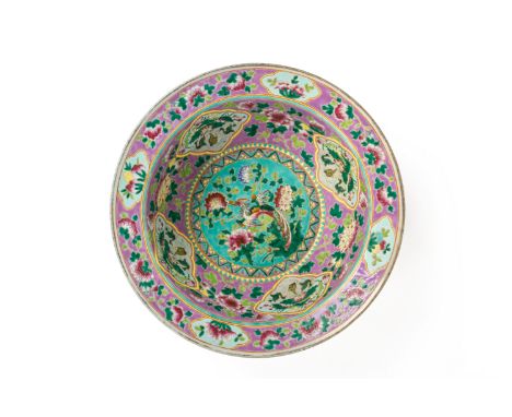 A LARGE PINK GROUND FAMILLE ROSE BASIN The centre of the basin decorated with a phoenix amongst peonies on a turquoise ground