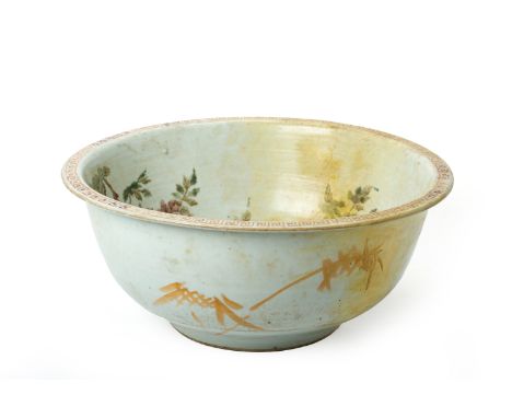 A FAMILLE ROSE PORCELAIN WASH BASIN
Decorated with birds perched on flowering peony branches and with key fret border to rim,