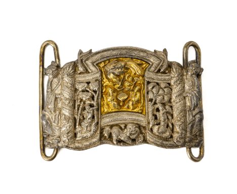 A SILVER AND SILVER GILT BELT BUCKLE
The central silver gilt panel with chased and engraved decoration of a phoenix and seate