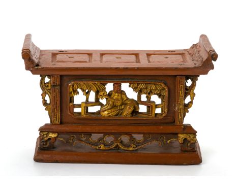 A RED LACQUER AND CARVED GILTWOOD ALTAR STAND
The central panel with a seated figure in an indoor setting
17cm high x 27cm wi