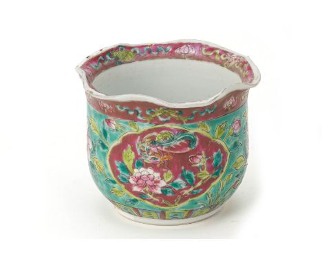 A TURQUOISE GROUND FAMILLE ROSE FINGER BOWL
With an undulating scalloped rim and decorated with a pink ground reserve of a ph