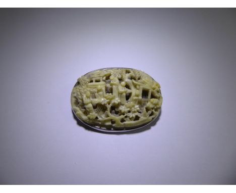 A Chinese Silver and Ivorine Carved Brooch, delicately carved with figures in a garden setting, approx 40 x 30 mm, approx 30 