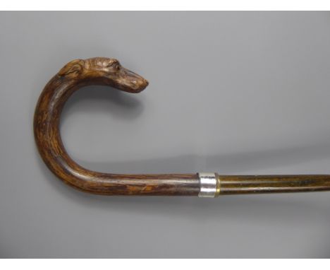 A Beautifully Crafted Gentleman's Walking Stick, carved with a Greyhound Head, having glass eyes.