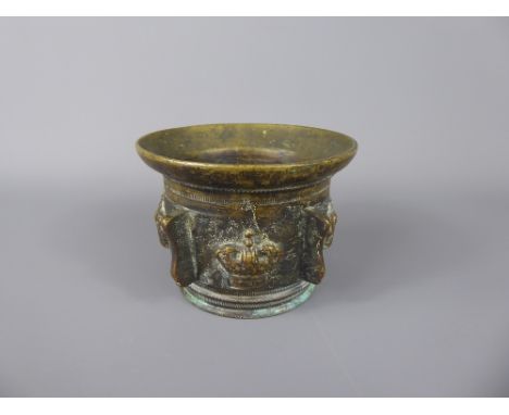 An Antique Bronze Mortar, cast with crowns and beaded decoration, approx 7.5 cms, approx 950 gms.