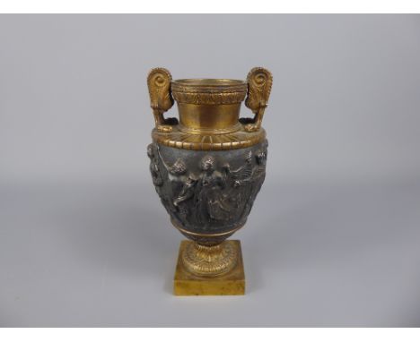 A Gilt Bronze Vase, a banded frieze depicting classical scenes in relief, approx 16 cms.