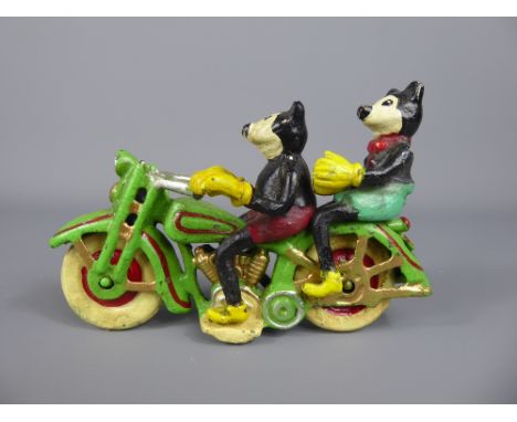 A Vintage Cast Iron Polychrome Model of Mickey and Minnie Mouse on a Motorbike.