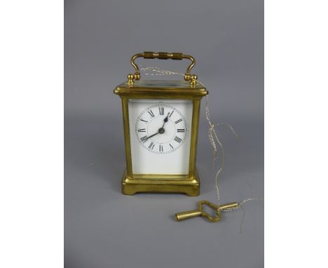 A Brass Carriage Clock, white enamel face with Roman dial, S F movement, approx 8 x 6 x 10 cms.