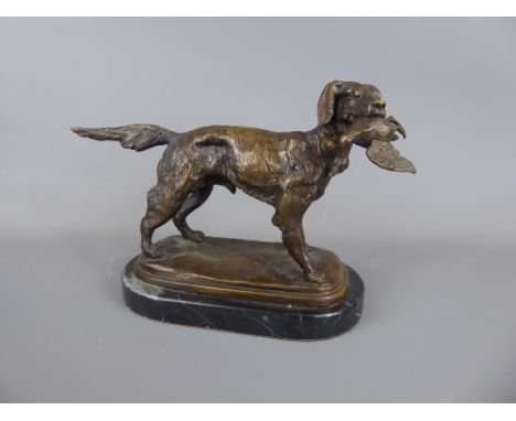 A Bronze Retriever with a Duck in its mouth, on marble plinth, approx 25 x 15 cms.