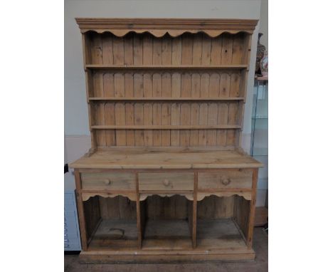 A Vintage Pine Dresser with three plate shelves to top and three drawers to bottom above three open alcoves, approx 154 x 194