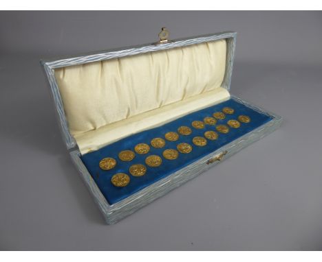 A Set of Twenty Two Vintage Continental Brass Buttons, in the original box.