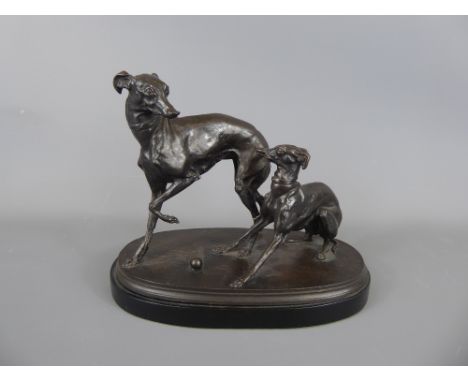 A Bronze Sculpture of Two Grey Hounds at play on an ebony plinth, signed Mene, approx 21 cms.