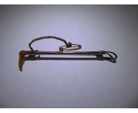 A 9 ct Yellow and White Gold Hunting Crop Stick Pin, mm J.G. & S, approx 3 gms.