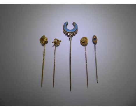 Six Antique Gentleman's Tie Sticks, including a 14/15 ct yellow gold and seed pearl tie stick, 14/15 ct gold floral tie stick