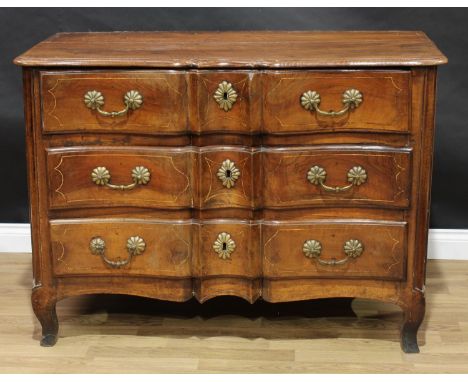 An 18th/19th century South European walnut serpentine commode, moulded top above three long drawers, fluted brass handles and