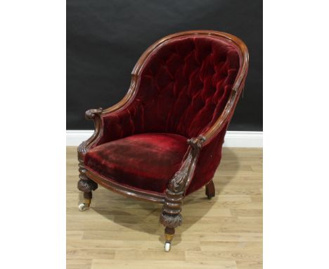 A Victorian mahogany library chair, sloping spoon-shaped back terminating in scroll arms, stuffed over deep button plum velve