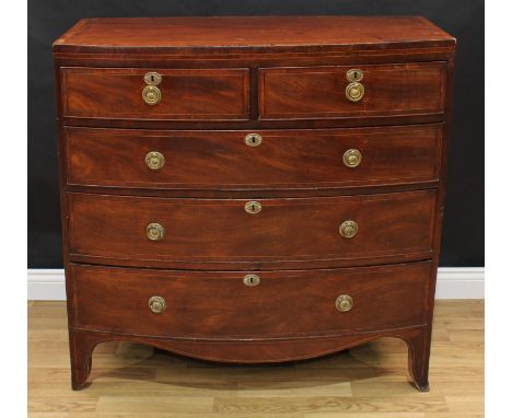 A Regency mahogany bow-front chest of two short and three long graduated cockbeaded drawers, crossbanded and outlined through