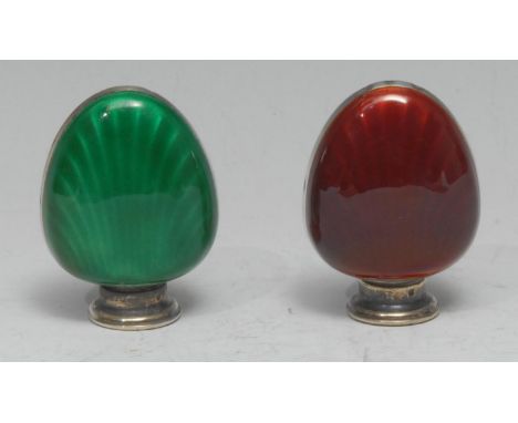A pair of Scandinavian silver and enamel shell shaped peppers, decorated in tones of green and red, 5cm high 