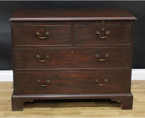 A George III mahogany chest, rectangular top with moulded edge above a slide, two short and two long cockbeaded drawers, bras