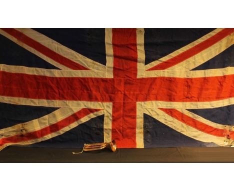 An early 20th century copper and brass bugle, 28cm long; a Union Flag, 125cm x 260cm, [2] 