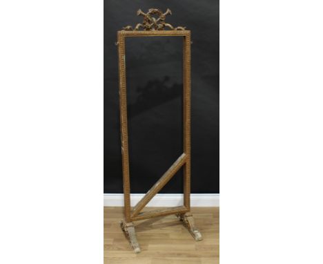 A Victorian giltwood rectangular room screen frame, wreath cresting centred by a musical trophy, hooks to sides, the stretche