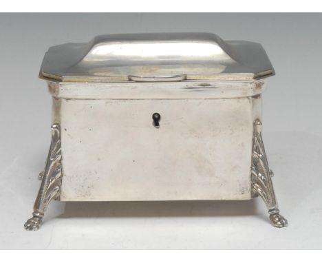 An Austrian silver rectangular tea caddy, hinged cover, the canted angles with acanthus cast buttress legs terminating in lio