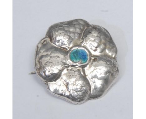 Liberty &amp; Co - an Arts and Crafts silver and enamel Cymric brooch, planished as flower and centered in turquoise enamel, 