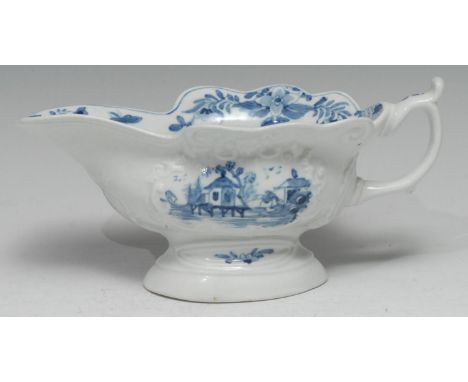 A Worcester Triangular Platform pattern sauceboat, of silver shape, painted in underglaze blue with Chinoiserie landscape vig