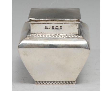 An Edwardian silver square bombe shaped tea caddy, of small proportions, hinged cover, ropetwist borders, 7cm high, Birmingha