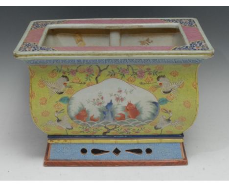 A Chinese porcelain table-top fish bowl or trough, the ogee-shaped body well-painted with peach-shaped reserves of carp in st