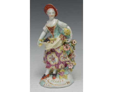 A Derby Patch Mark figure, Allegorical of Summer, she stands wearing a broad brimmed hat, with fruit and flowers in her apron