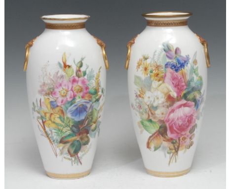 A pair of Worcester Royal Porcelain Company Ltd flattened vases, each side well-painted with a profusion of English summer fl