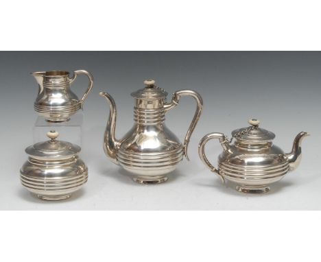 A 19th century Russian silver four piece tea and coffee service, comprising teapot, coffee pot, milk jug and sucrier, domed c