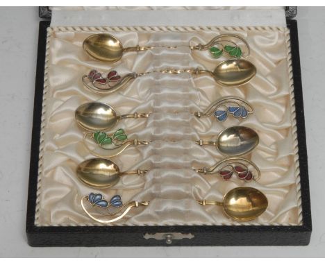 A set of six Danish silver-gilt and plique a jour enamel coffee spoons, decorated with stylised flower petals, 9.5cm long, re