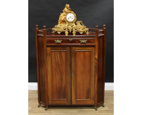 An Aesthetic Movement mahogany low corner salon cabinet, spindle gallery above a frieze drawer and a pair of rectangular pane