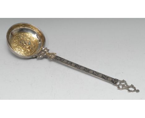 An unusual 19th century Russian silver and niello ladle, the gilt circular bowl chased with birds and hunting dogs, and appli