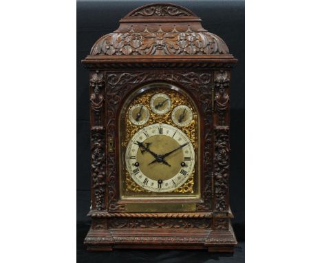A Victorian oak musical bracket clock, 24cm arched brass dial with silvered chapter ring inscribed with Roman and Arabic nume