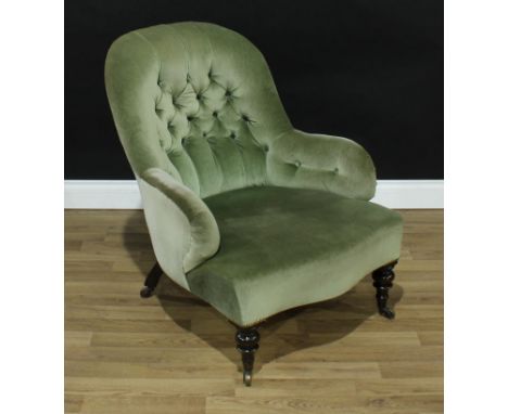 A Victorian walnut drawing room chair, deep button stuffed over upholstery, turned legs, ceramic casters, 86cm high, 66cm wid