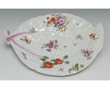 A Worcester cos lettuce leaf dish, painted in the 'Rogers' style with polychrome flowers in the manner of Meissen, 25cm wide,