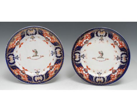 A pair of Chamberlains Worcester King's pattern armorial plates, each centred by the Skinner crest and motto, Imari borders, 