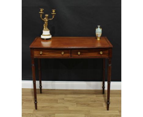 A George III mahogany side table, slightly bow-front rectangular top with reeded edge and outlined with ebony stringing, abov