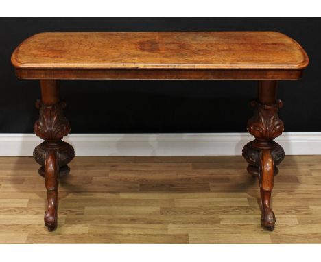 A Victorian walnut centre table, moulded top, boldly carved acanthus grasped tapered cylindrical supports, cabriole legs, scr