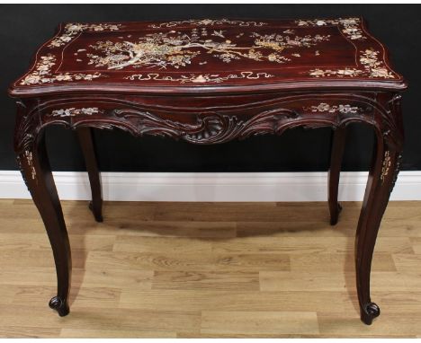 A Chinese hardwood and mother-of-pearl marquetry serpentine centre table, in the 18th century European taste, moulded top pro