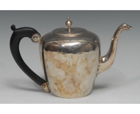 A Louis XV French silver bullet shaped teapot, push-fitting cover with knop finial, zoomorphic spout, ebony scroll-capped han