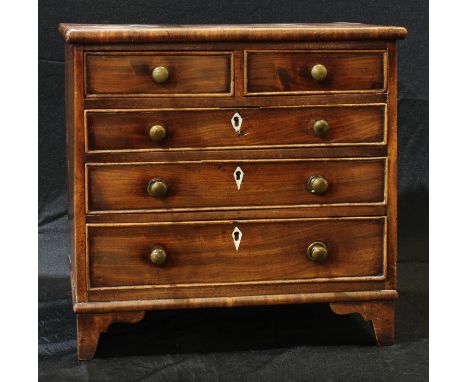 Miniature Furniture - a 19th century mahogany chest, slightly oversailing rectangular top above two short and three long grad