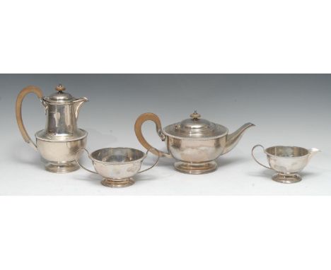 A George V silver four piece tea service, comprising teapot, hot water pot, milk jug and sugar basin, gadrooned borders, hing